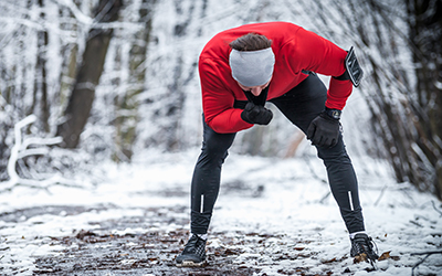 Man takes a break during outdoor training in winter.