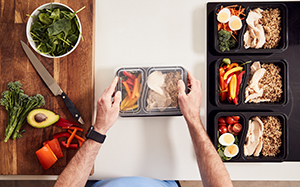 Person preps several meals ahead of time to eat at work or other places outside the home.