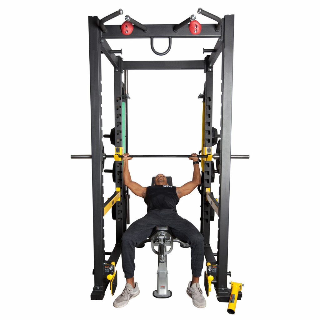 Fitness First power rack with athlete using the power rack for bench press.